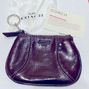 Coach key pouch in brown patent leather. New without tag.